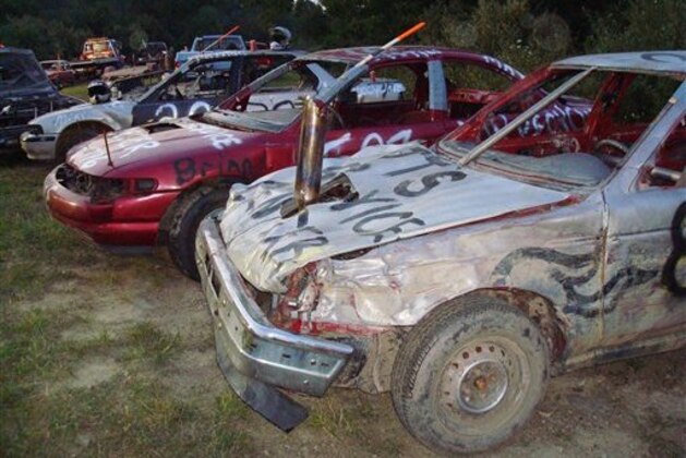 Cars are lined up awaiting the next round of competition at the Valley District Fair Demolition Derby, Wednesday, Aug. 13, 2008 in Reedsville, W.Va.. Soaring scrap metal prices are making crashable cars more expensive and harder to find. (AP Photo/Vicki Smith)