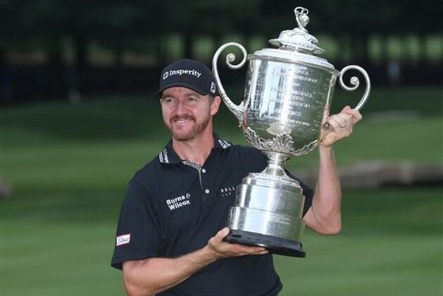 Jimmy Walker poses with the trophy after winning the PGA Championship golf tournament at Baltusrol Golf Club in Springfield, N.J., Sunday, July 31, 2016. (AP Photo/Seth Wenig)