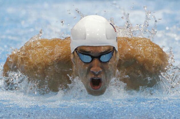 FILE - In this July 28, 2012, file photo, Michael Phelps competes in a heat of the men's 400-meter individual medley at the 2012 Summer Olympics in London. After retiring and then un-retiring, Phelps will be in Rio as the first U.S. male swimmer to compete in five Olympics. (AP Photo/Michael Sohn, File)
