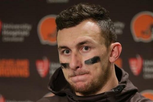 FILE - In this Dec. 20, 2015, file photo, Cleveland Browns quarterback Johnny Manziel speaks with media members following the team's 30-13 loss to the Seattle Seahawks in an NFL football game, in Seattle. Manziel has been suspended for the first four games of next season for violating the NFL's substance-abuse policy.The suspension announced Thursday, June 30, 2016, is not related to the NFL's domestic violence policy, but the free agent quarterback would be subject to it if he signs with another team. (AP Photo/Scott Eklund, File)