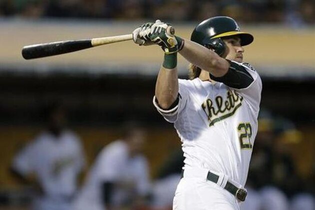 Oakland Athletics' Josh Reddick swings for a double in the fifth inning of a baseball game against the Pittsburgh Pirates, Saturday, July 2, 2016, in Oakland, Calif. (AP Photo/Ben Margot)