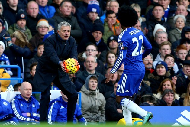 LONDON, ENGLAND - NOVEMBER 21: Jose Mourinho Manager of Chelsea passes the ball to Willian during the Barclays Premier League match between Chelsea and Norwich City at Stamford Bridge on November 21, 2015 in London, England.  (Photo by Paul Gilham/Getty Images)