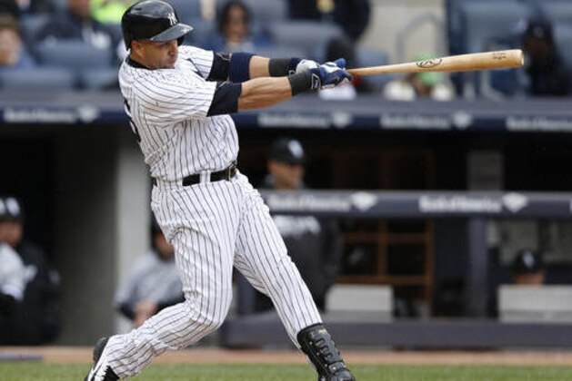 FILE - In this May 15, 2016, file photo, New York Yankees Carlos Beltran hits a two-run home run off the Chicago White Sox' Zach Duke in the sixth inning of a baseball game in New York. The Yankees stepped up their rebuilding, Monday, Aug. 1, 2016, trading outfielder Carlos Beltran to the AL West-leading Texas Rangers for right-hander Dillon Tate, the fourth overall pick in the 2015 amateur draft, and two other pitching prospects.  (AP Photo/Kathy Willens, File)