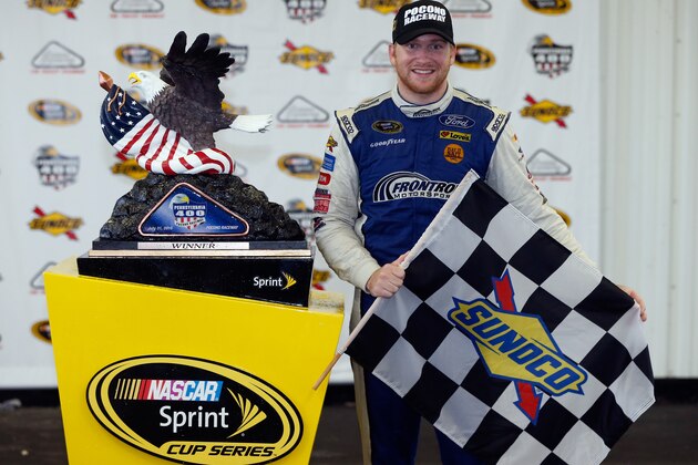 LONG POND, PA - AUGUST 01:  Chris Buescher, driver of the #34 Dockside Logistics Ford, celebrates in victory lane after winning the NASCAR Sprint Cup Series Pennsylvania 400 at Pocono Raceway on August 1, 2016 in Long Pond, Pennsylvania. The race was delayed due to inclement weather on Sunday, July 31.  (Photo by Brian Lawdermilk/Getty Images)