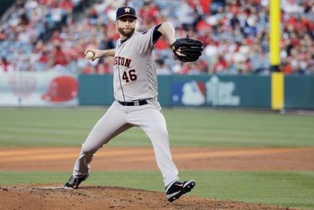 Houston Astros starting pitcher Scott Feldman works against the Los Angeles Angels during the first inning of a baseball game Tuesday, June 28, 2016, in Anaheim, Calif. (AP Photo/Gregory Bull)