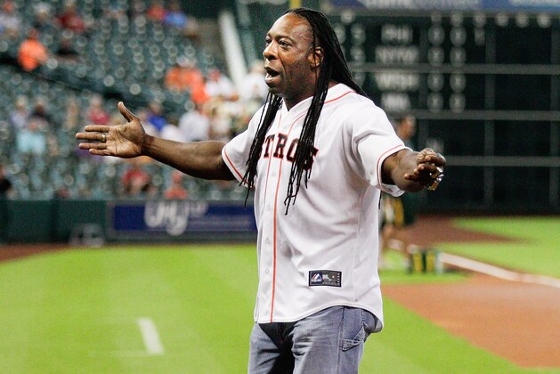 HOUSTON, TX - JULY 29:  WWE Superstar Booker T throws out the first pitch at Minute Maid Park on July 29, 2014 in Houston, Texas.  (Photo by Bob Levey/Getty Images)