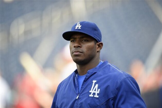 Los Angeles Dodgers' Yasiel Puig looks on before a baseball game against the Washington Nationals, Tuesday, July 19, 2016, in Washington. (AP Photo/Nick Wass)