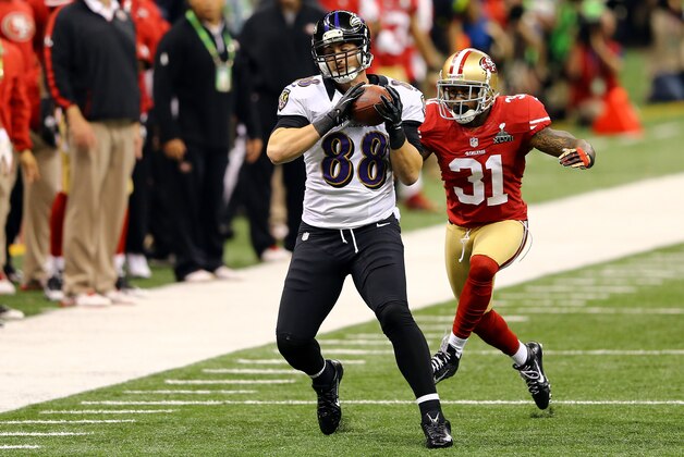 NEW ORLEANS, LA - FEBRUARY 03:  Dennis Pitta #88 of the Baltimore Ravens makes a reception against Donte Whitner #31 of the San Francisco 49ers during Super Bowl XLVII at the Mercedes-Benz Superdome on February 3, 2013 in New Orleans, Louisiana. The Ravens won 34-31. (Photo by Al Bello/Getty Images)