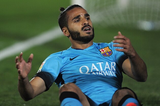 Barcelona's Brazilian defender Douglas sits on the field during the Spanish Copa del Rey (King's Cup) Round of 32 first leg football match CF Villanovense vs FC Barcelona at the Romero Cuerda stadium in Villanueva de la Serena on October 28, 2015. AFP PHOTO / CRISTINA QUICLER        (Photo credit should read CRISTINA QUICLER/AFP/Getty Images)