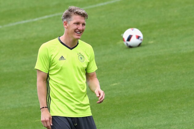 EVIAN-LES-BAINS, FRANCE - JUNE 25:  Bastian Schweinsteiger of Germany smiles during a Germany training session ahead of their Euro 2016 round of 16 match against Slovakia at Ermitage Evian on June 25, 2016 in Evian-les-Bains, France.  (Photo by Alexander Hassenstein/Getty Images)