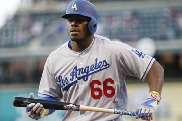 Los Angeles Dodgers' Yasiel Puig reacts after striking out against Colorado Rockies starting pitcher Jon Gray in the first inning of a baseball game Friday, April 22, 2016, in Denver. (AP Photo/David Zalubowski)