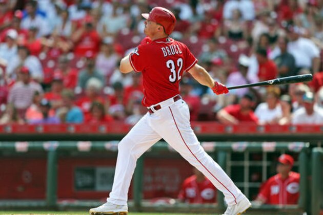 Cincinnati Reds' Jay Bruce watches as he hits a three-run home run off Arizona Diamondbacks' Tyler Clippard in the ninth inning of a baseball game, Sunday, July 24, 2016, in Cincinnati. (AP Photo/Aaron Doster)