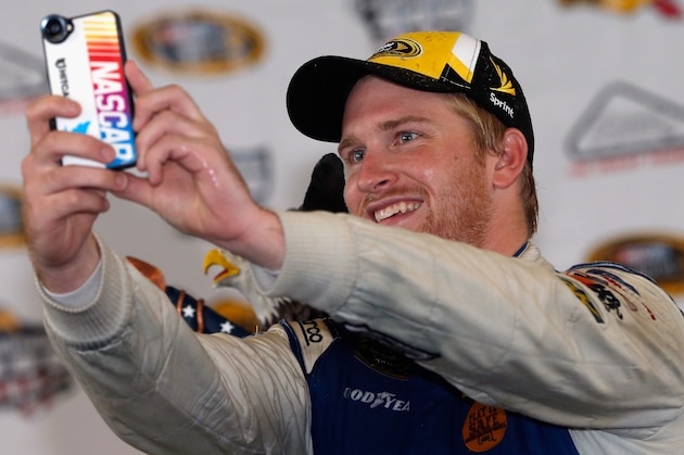 LONG POND, PA - AUGUST 01:  Chris Buescher, driver of the #34 Dockside Logistics Ford, celebrates in victory lane after winning the NASCAR Sprint Cup Series Pennsylvania 400 at Pocono Raceway on August 1, 2016 in Long Pond, Pennsylvania. The race was delayed due to inclement weather on Sunday, July 31.  (Photo by Brian Lawdermilk/Getty Images)