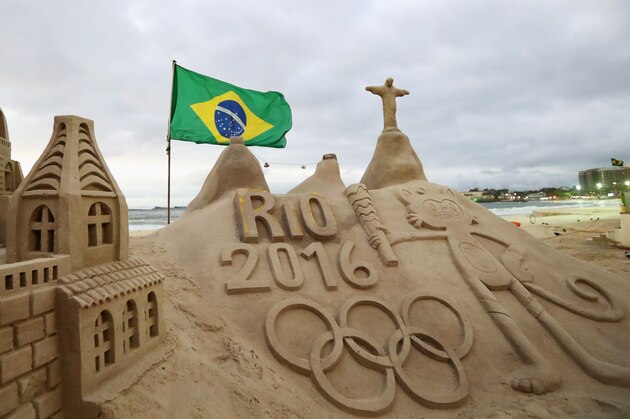 RIO DE JANEIRO, BRAZIL - AUGUST 01:  A general view of the Olympic Rings, flag, Vinicius and Christ the Redeemer made into a sand sculpture on the beach during the Olympics preview day - 5 at the Copacabana Beach on July 30, 2016 in Rio de Janeiro, Brazil.  (Photo by Dean Mouhtaropoulos/Getty Images)