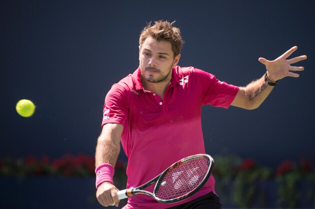 Stan Wawrinka of Switzerland returns the ball against Kei Nishikori of Japan during men's semifinals Rogers Cup tennis action in Toronto, Canada July 30, 2016. / AFP / KEVIN VAN PAASSEN        (Photo credit should read KEVIN VAN PAASSEN/AFP/Getty Images)