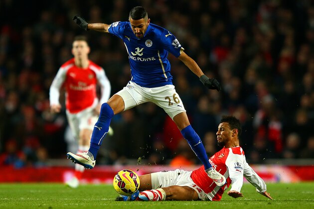 LONDON, ENGLAND - FEBRUARY 10:  Francis Coquelin of Arsenal slides in on Riyad Mahrez of Leicester City during the Barclays Premier League match between Arsenal and Leicester City at Emirates Stadium on February 10, 2015 in London, England.  (Photo by Richard Heathcote/Getty Images)