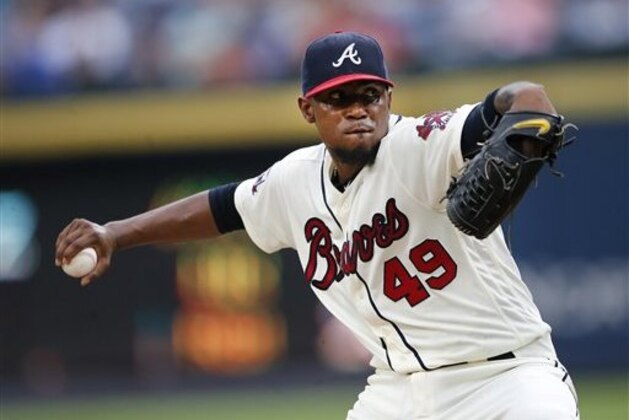 Atlanta Braves starting pitcher Julio Teheran (49) delivers in the first inning of a baseball game  against the Philadelphia Phillies Saturday, July 30, 2016, in Atlanta.  (AP Photo/John Bazemore)