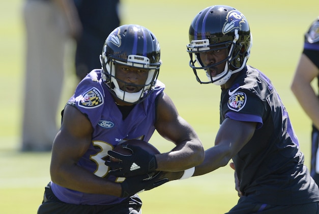 Jun 14, 2016; Baltimore, MD, USA; Baltimore Ravens running back Trent Richardson (33) talks a hand off from quarterback Jerrod Johnson (8) during the first day of minicamp sessions at Under Armour Performance Center. Mandatory Credit: Tommy Gilligan-USA TODAY Sports