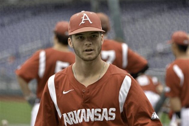 Arkansas outfielder Andrew Benintendi is seen during team practice at TD Ameritrade Park in Omaha, Neb., Friday, June 12, 2015. Arkansas plays Virginia in an NCAA College World Series baseball game on Saturday. (AP Photo/Mike Theiler)