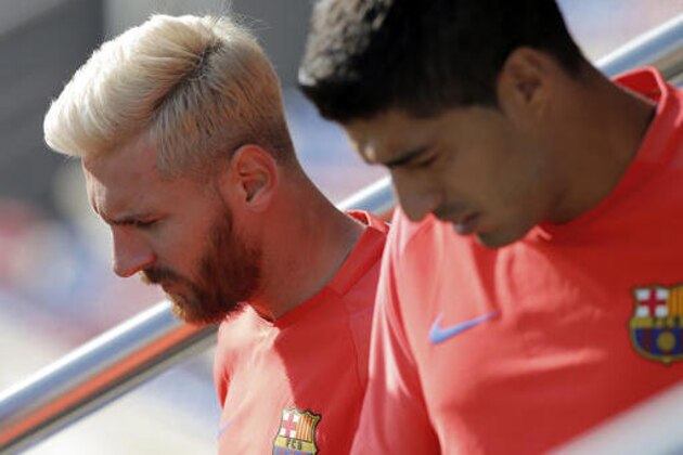 FC Barcelona's Lionel Messi, left, and Luis Suarez attend a training session at the Sports Center FC Barcelona Joan Gamper in Sant Joan Despi, Spain, Monday, Aug. 1, 2016. (AP Photo/Manu Fernandez)