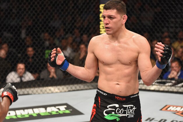 LAS VEGAS, NV - JANUARY 31:  (R-L) Nick Diaz taunts Anderson Silva of Brazil in their middleweight bout during the UFC 183 event at the MGM Grand Garden Arena on January 31, 2015 in Las Vegas, Nevada.  (Photo by Josh Hedges/Zuffa LLC/Zuffa LLC via Getty Images)