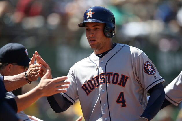 OAKLAND, CA - JULY 20:  George Springer #4 of the Houston Astros celebrates with his teammates after scoring a run against the Oakland Athletics during the game at the Oakland Coliseum on Wednesday, July 20, 2016 in Oakland, California. (Photo by Brad Mangin/MLB Photos via Getty Images)