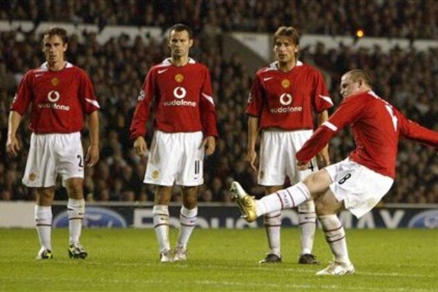 Manchester United's Wayne Rooney, right, fires in his third goal from a free kick against Fenerbahce during their UEFA Champion's League group D soccer match at Old Trafford Stadium, Manchester England, Tuesday Sept. 28, 2004. (AP Photo/Jon Super)