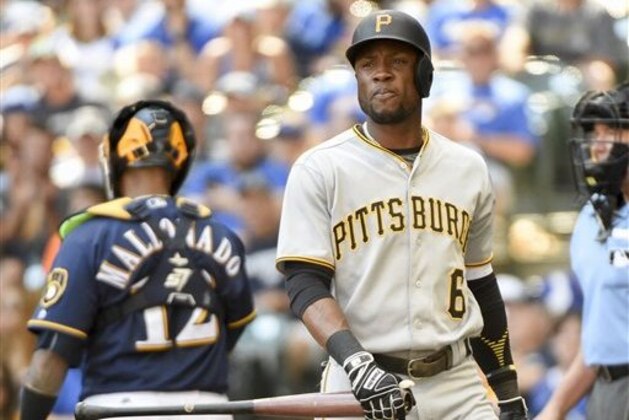 Pittsburgh Pirates' Starling Marte walks back to the dugout after striking out during the sixth inning of a baseball game against the Milwaukee Brewers Sunday, July 31, 2016, in Milwaukee. (AP Photo/Benny Sieu)