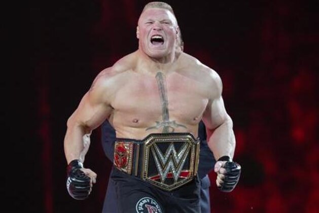 FILE - In this March 29, 2015, file photo, Brock Lesnar makes his entrance at Wrestlemania XXXI in Santa Clara, Calif. Lesnar, the former WWE and UFC heavyweight champion, was selected Monday, June 27, 2016, as the cover superstar for the WWE 2K17 video game that is set for an Oct. 11 release.  (AP Photo/Don Feria, File)