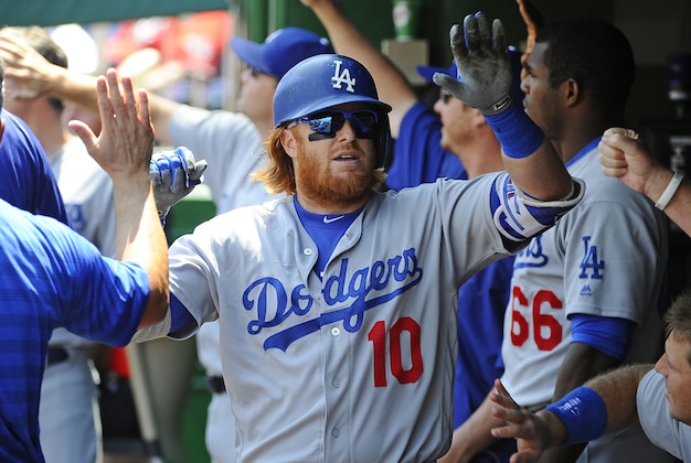 Jul 21, 2016; Washington, DC, USA; Los Angeles Dodgers third baseman Justin Turner (10) is congratulated by teammates after hitting a three run homer against the Washington Nationals during the third inning at Nationals Park. Mandatory Credit: Brad Mills-USA TODAY Sports