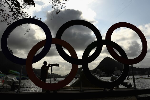 RIO DE JANEIRO, BRAZIL - AUGUST 03:  A photographer takes photos of Rowing practise at Lagoa Rodrigo de Freitas on August 3, 2016 in Rio de Janeiro, Brazil.  (Photo by Quinn Rooney/Getty Images)