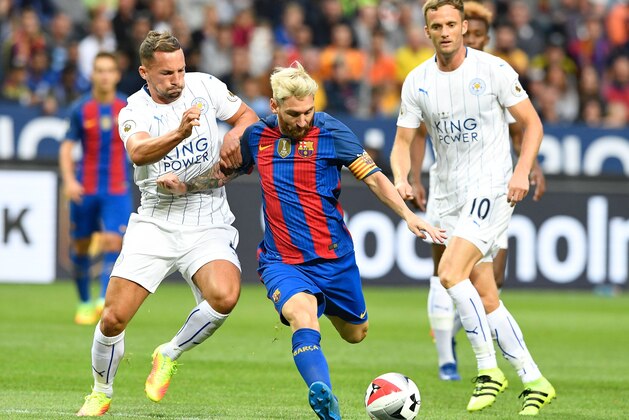 Leicester's English midfielder Danny Drinkwater (L) vies with Barcelona's Argentinian forward Lionel Messi during the 2016 International Champions Cup football match between FC Barcelona and Leicester City at Friends Arena on August 3, 2016 in Solna, Sweden. / AFP / JONATHAN NACKSTRAND        (Photo credit should read JONATHAN NACKSTRAND/AFP/Getty Images)