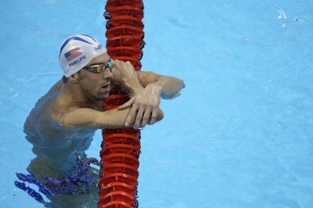United States' Michael Phelps holds on a lane marker during a training session prior to the 2016 Summer Olympics in Rio de Janeiro, Brazil, Tuesday, Aug. 2, 2016. (AP Photo/Matt Slocum)