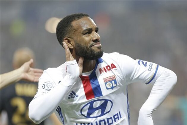 Lyon's Alexandre Lacazette celebrates after he scored a goal against Monaco during their French League One soccer match in Decines, near Lyon, central France, Saturday, May 7, 2016. (AP Photo/Laurent Cipriani)