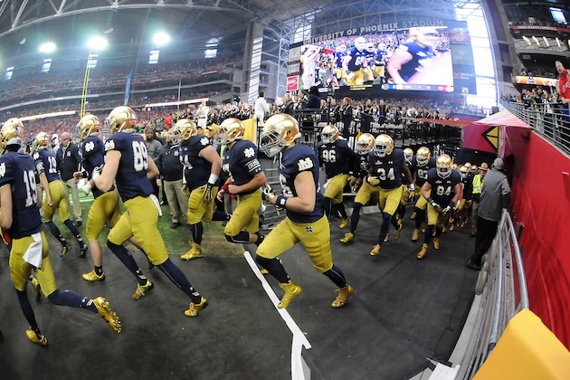 GLENDALE, AZ - JANUARY 01:  The Notre Dame Fighting Irish run onto the field before the BattleFrog Fiesta Bowl against the Ohio State Buckeyes at the University of Phoenix Stadium on January 1, 2016 in Glendale, Arizona.  (Photo by Norm Hall/Getty Images)