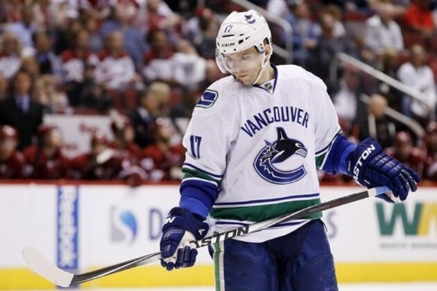 Vancouver Canucks' Radim Vrbata, of the Czech Republic, looks down at his stick during the third period of an NHL hockey game against the Arizona Coyotes Sunday, March 22, 2015, in Glendale, Ariz.  The Canucks defeated the Coyotes 3-1. (AP Photo/Ross D. Franklin)