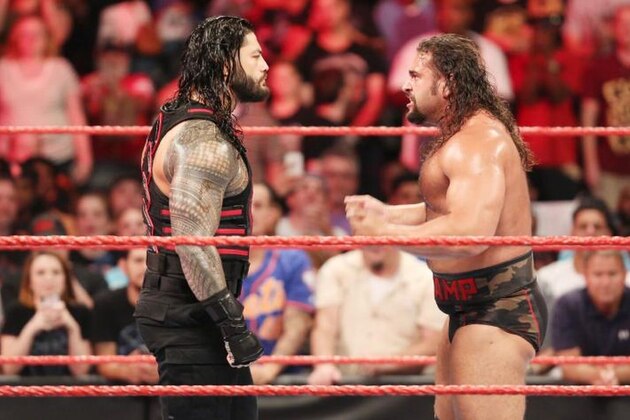 Roman Reigns confronts an angry Rusev.