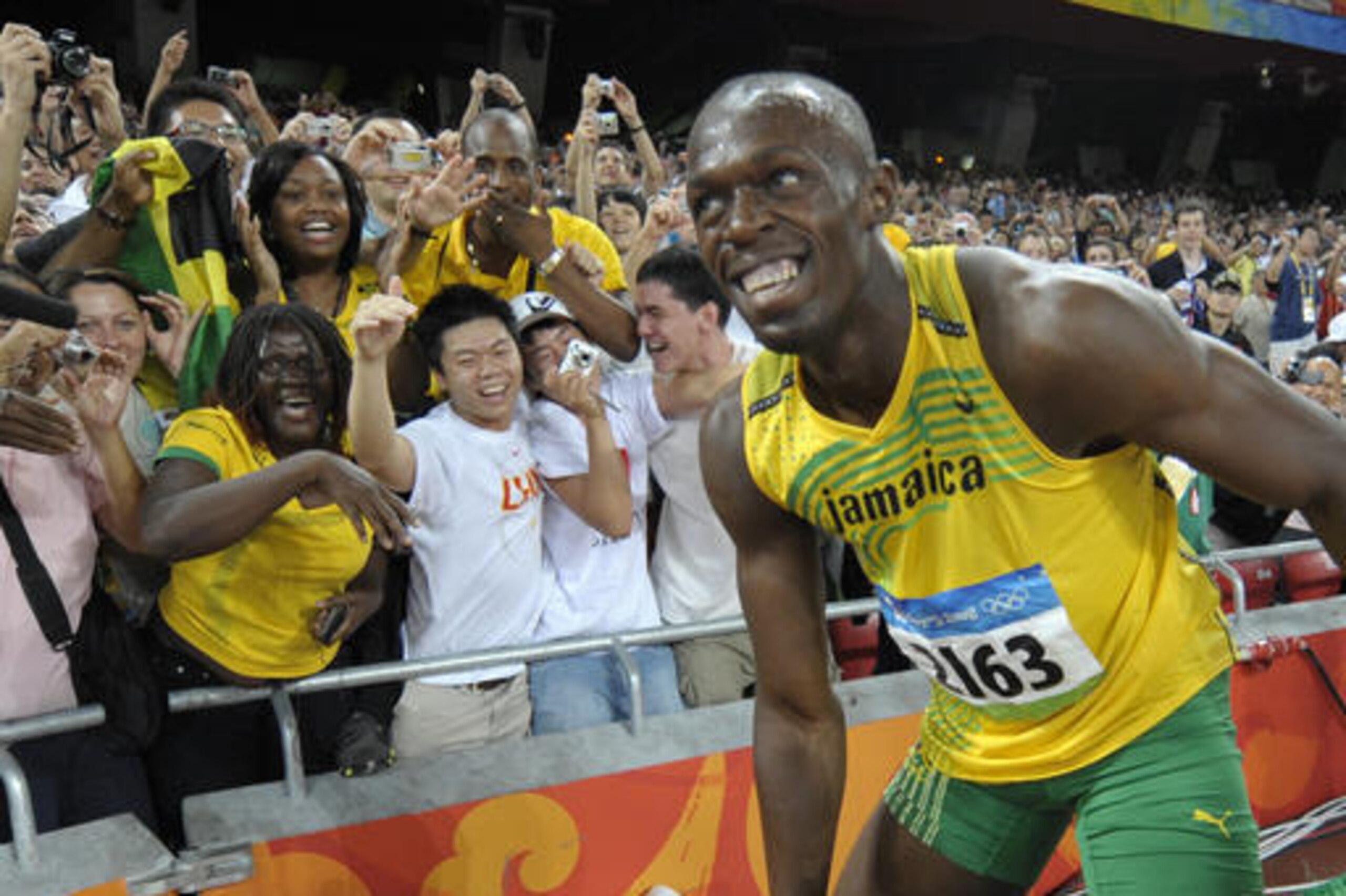 FILE - In this Aug. 16, 2008, file photo, Usain Bolt of Jamaica smiles at cheering spectators after winning the men's 100-meter final with a world record in the National Stadium at the Beijing 2008 Olympics in Beijing. Since he coasted to the 100-meter finish line in world-record time at the Bird's Nest eight years ago, Usain Bolt has been the smiling face of track and field. He has served as the anchorman of the Olympics, virtually the only reason any casual fan would pay attention to a sport that has orchestrated its own slow, sad, drug-infused downfall. (AP Photo/Thomas Kienzle, File) FILE - In this Aug. 16, 2008, file photo, Usain Bolt of Jamaica smiles at cheering spectators after winning the men's 100-meter final with a world record in the National Stadium at the Beijing 2008 Olympics in Beijing. Since he coasted to the 100-meter finish line in world-record time at the Bird's Nest eight years ago, Usain Bolt has been the smiling face of track and field. He has served as the anchorman of the Olympics, virtually the only reason any casual fan would pay attention to a sport that has orchestrated its own slow, sad, drug-infused downfall. (AP Photo/Thomas Kienzle, File)