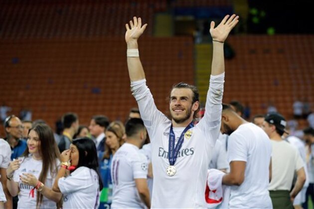 Real Madrid's Gareth Bale celebrates  after the Champions League final soccer match between Real Madrid and Atletico Madrid at the San Siro stadium in Milan, Italy, Saturday, May 28, 2016. Real Madrid won 5-3 on penalties after the match ended 1-1 after extra time.     (AP Photo/Manu Fernandez)