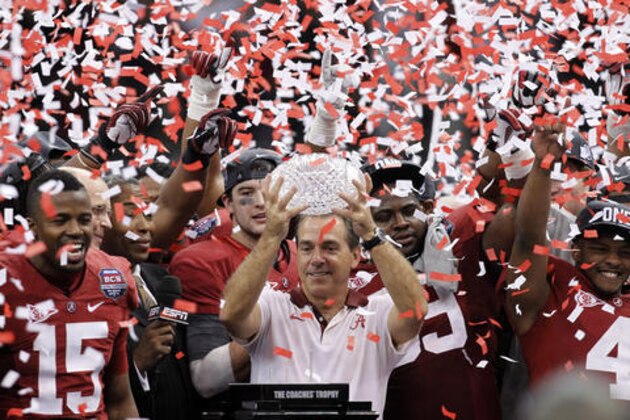 FILE - In this Jan. 9, 2012, file photo, Alabama head coach Nick Saban celebrates with his team after the BCS National Championship college football game against LSU, in New Orleans. The one constant in college football over the last 80 years has been the AP poll. It has helped link the past with the present and provided perspective. (AP Photo/Gerald Herbert, File)