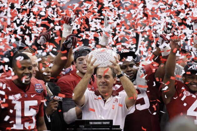 FILE - In this Jan. 9, 2012, file photo, Alabama head coach Nick Saban celebrates with his team after the BCS National Championship college football game against LSU, in New Orleans. The one constant in college football over the last 80 years has been the AP poll. It has helped link the past with the present and provided perspective. (AP Photo/Gerald Herbert, File)
