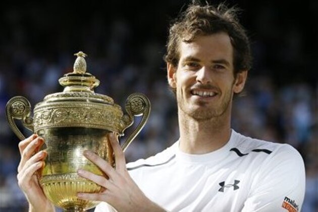 Andy Murray of Britain holds the trophy after beating Milos Raonic of Canada in the men's singles final on day fourteen of the Wimbledon Tennis Championships in London, Sunday, July 10, 2016. (AP Photo/Kirsty Wigglesworth)
