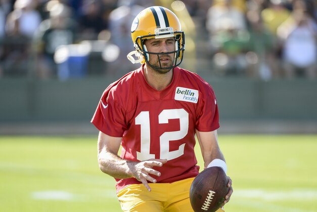 Jul 26, 2016; De Pere, WI, USA; Green Bay Packers quarterback Aaron Rodgers (12) participate in a drill during training camp at Ray Nitschke Field. Mandatory Credit: Benny Sieu-USA TODAY Sports