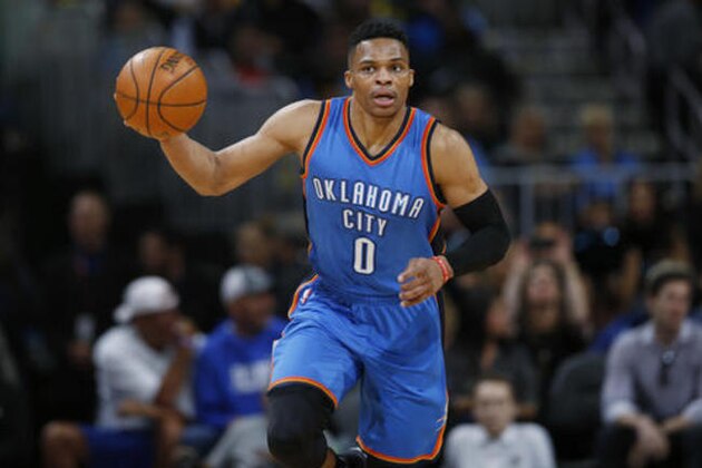 Oklahoma City Thunder guard Russell Westbrook picks up a loose ball and heads down the court against the Denver Nuggets during the first half of an NBA basketball game Tuesday, April 5, 2016, in Denver. (AP Photo/David Zalubowski)