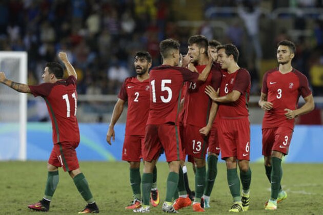 Portugal's Pite, 13, is congratulated after scoring his side's 2nd goal during a group D match of the men's Olympic football tournament between Portugal and Argentina at the Rio Olympic Stadium in Rio De Janeiro, Brazil, Thursday, Aug. 4, 2016. Portugal won 2-0. (AP Photo/Leo Correa)