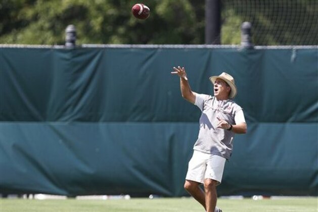 Alabama coach Nick Saban runs drills with his players during an NCAA college football practice, Thursday, Aug. 4, 2016, in Tuscaloosa, Ala. (AP Photo/Brynn Anderson)