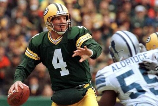 FILE - In this Nov. 21, 1999, file photo, Green Bay Packers quarterback Brett Favre (4) drops back to pass while being rushed by Detroit Lions' Allen Aldridge in the fourth quarter of an NFL football game in Green Bay, Wis. Favre was equal parts desperado and virtuoso during his 20-year NFL career that was predicated on taking big risks in the game's biggest moments. Favre will be inducted into the Pro Football Hall of Fame on Saturday, Aug. 6, 2016, in Canton, Ohio. (AP Photo/Mike Roemer, File)