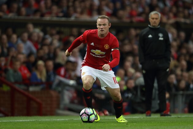 MANCHESTER, ENGLAND - AUGUST 03: Jose Mourinho the head coach / manager of Manchester United watches over Wayne Rooney during the Wayne Rooney Testimonial match between Manchester United and Everton at Old Trafford on August 3, 2016 in Manchester, England.  (Photo by Matthew Ashton - AMA/Getty Images)