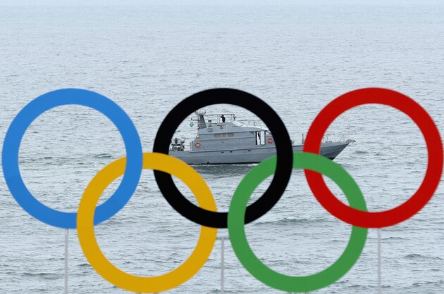 RIO DE JANEIRO, BRAZIL - AUGUST 03:  A security boat sails past the Olympic rings above the Arena de Vlei de Praia Beach Volleyball Venue during a training session on August 3, 2016 in Rio de Janeiro, Brazil.  (Photo by Ezra Shaw/Getty Images)