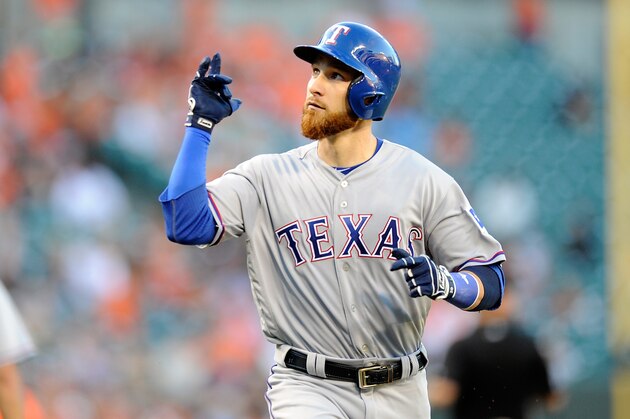 BALTIMORE, MD - AUGUST 04: Jonathan Lucroy #25 of the Texas Rangers celebrates after hitting a home run in the second inning against the Baltimore Orioles at Oriole Park at Camden Yards on August 4, 2016 in Baltimore, Maryland.  (Photo by Greg Fiume/Getty Images)